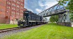 WE 4602 shoves a car for Landmark Plastics under the A&BB RR bridge that's been abondoned for about 30 years.